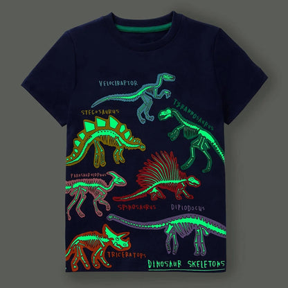 Go Glow dinosaur t-shirt featuring glowing dinosaur skeleton illustrations in various colors on a dark background.