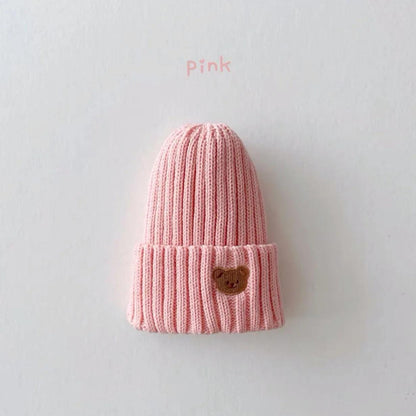 Little Tickle baby hat in pink color, featuring a cute embroidered bear face on the front.