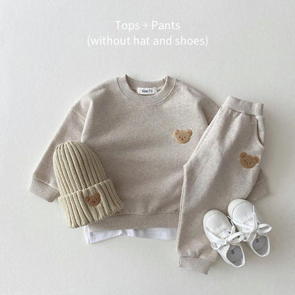 Soft and cozy gray baby outfit set featuring a sweatshirt and matching pants with adorable embroidered bear face details